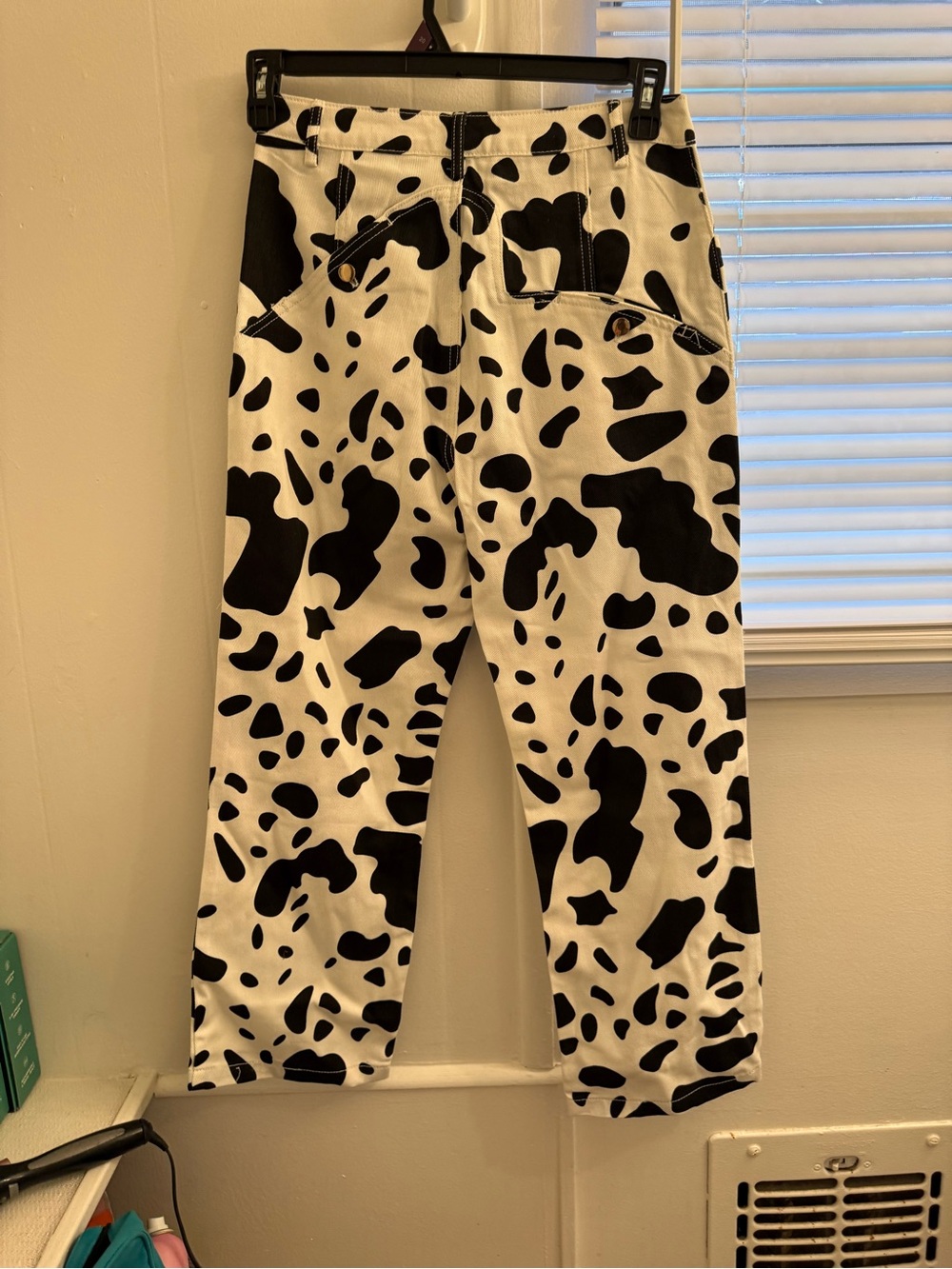 Cider Black and White Cow Print Straight Leg Jeans
